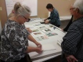 collating and stacking 27 sets of 8 prints takes teamwork